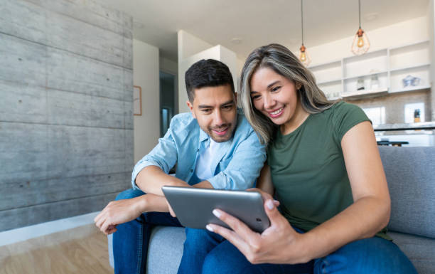 couple looking at tablet